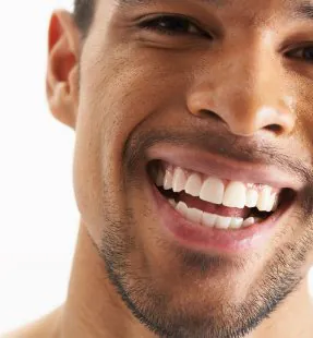 Correcting Misshapen Teeth: Crowns and Veneers Explained
